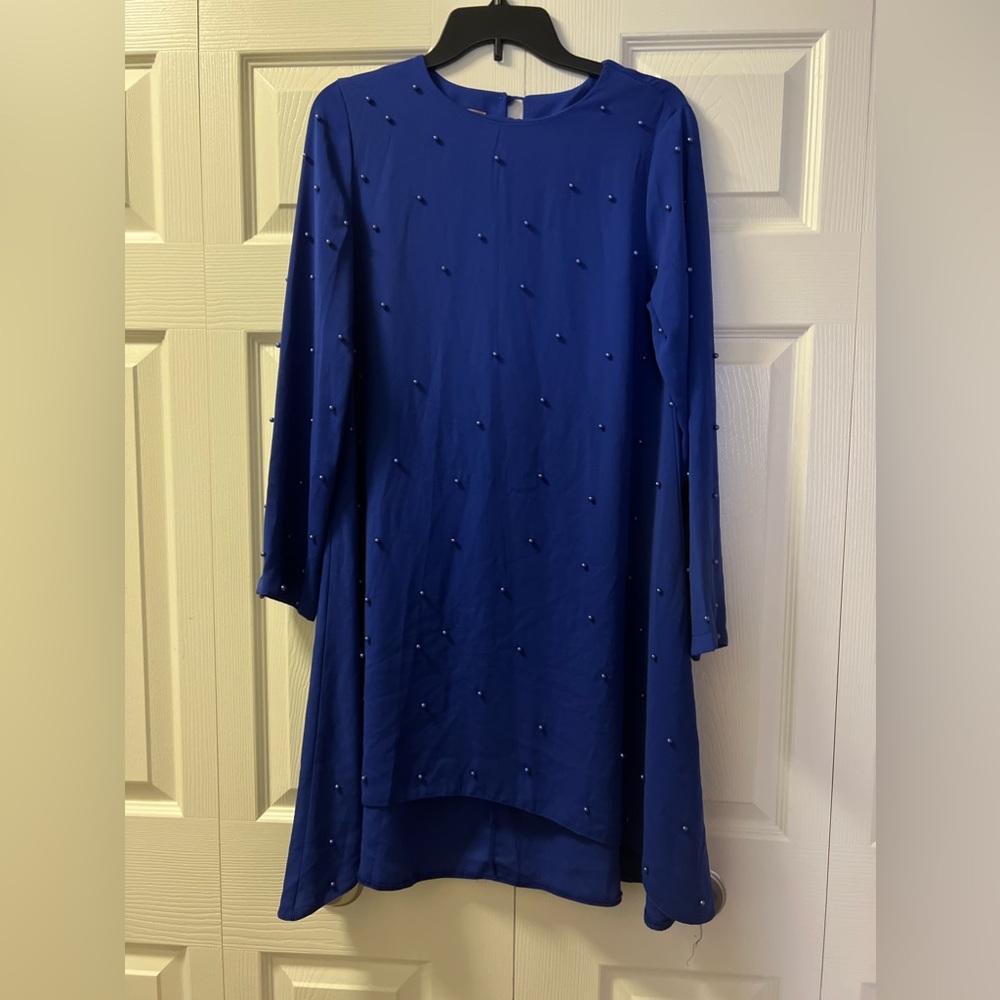 A timeless long sleeve shirt in a cool and versatile blue color.